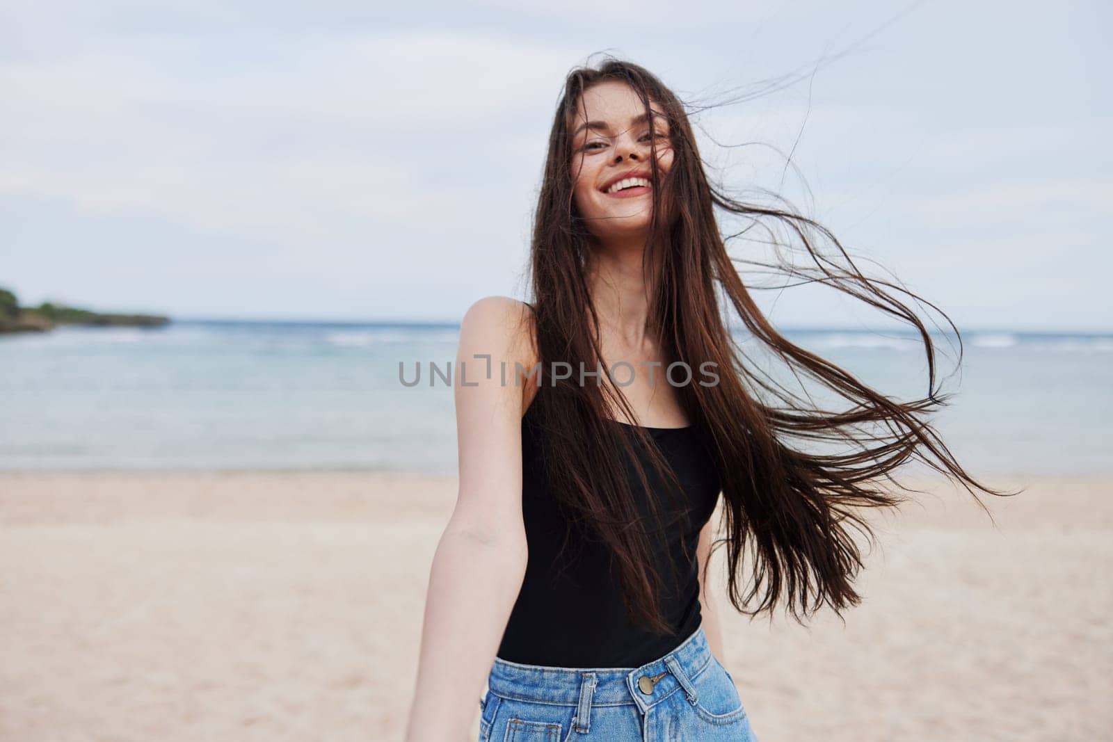 girl woman wave copy summer freedom sand space sea beach travel hair beautiful running carefree ocean young lifestyle relax smile happy sunset