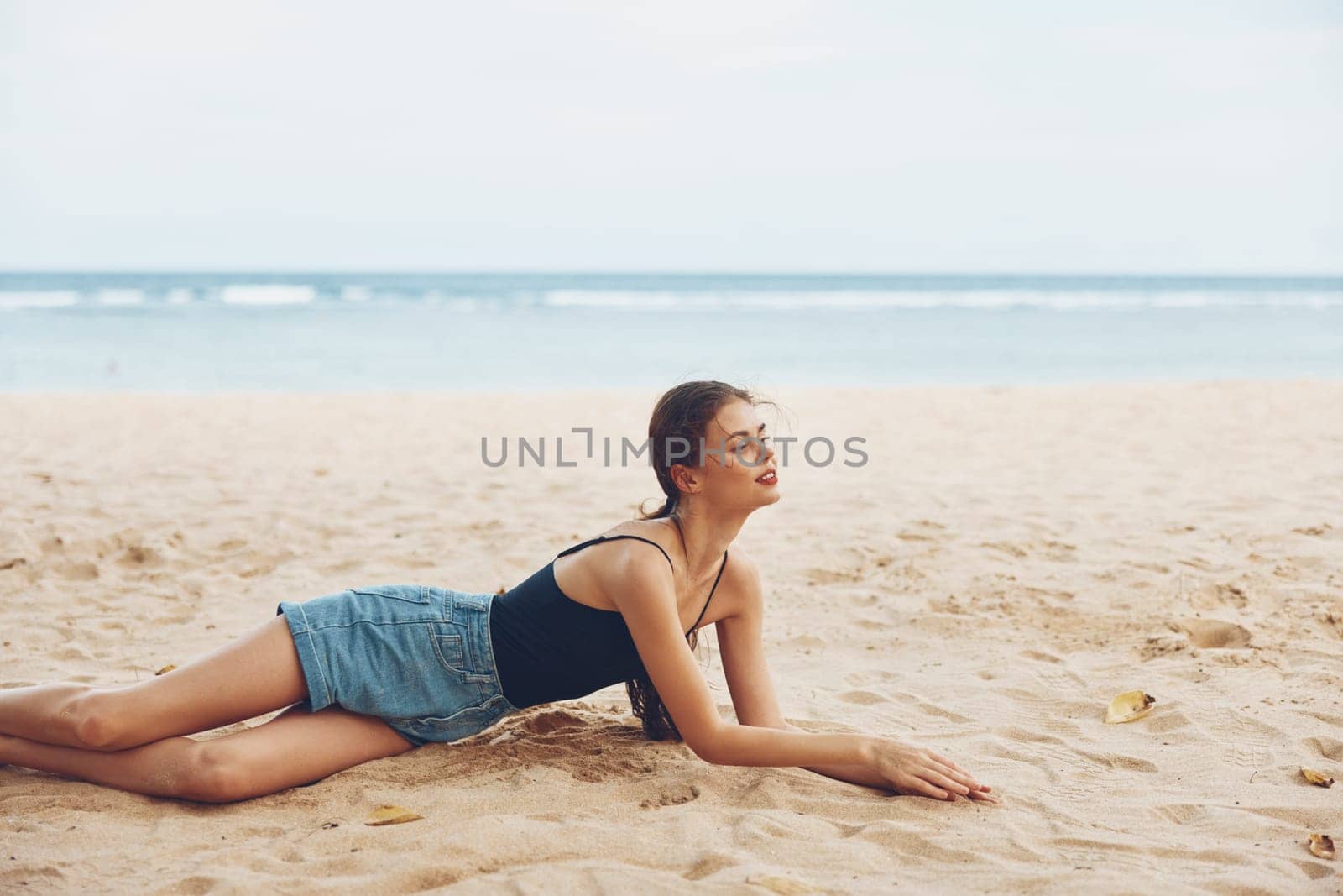 woman freedom person tan sun natural sitting smile water white travel nature hair sand coast adult body sea vacation fashion beach