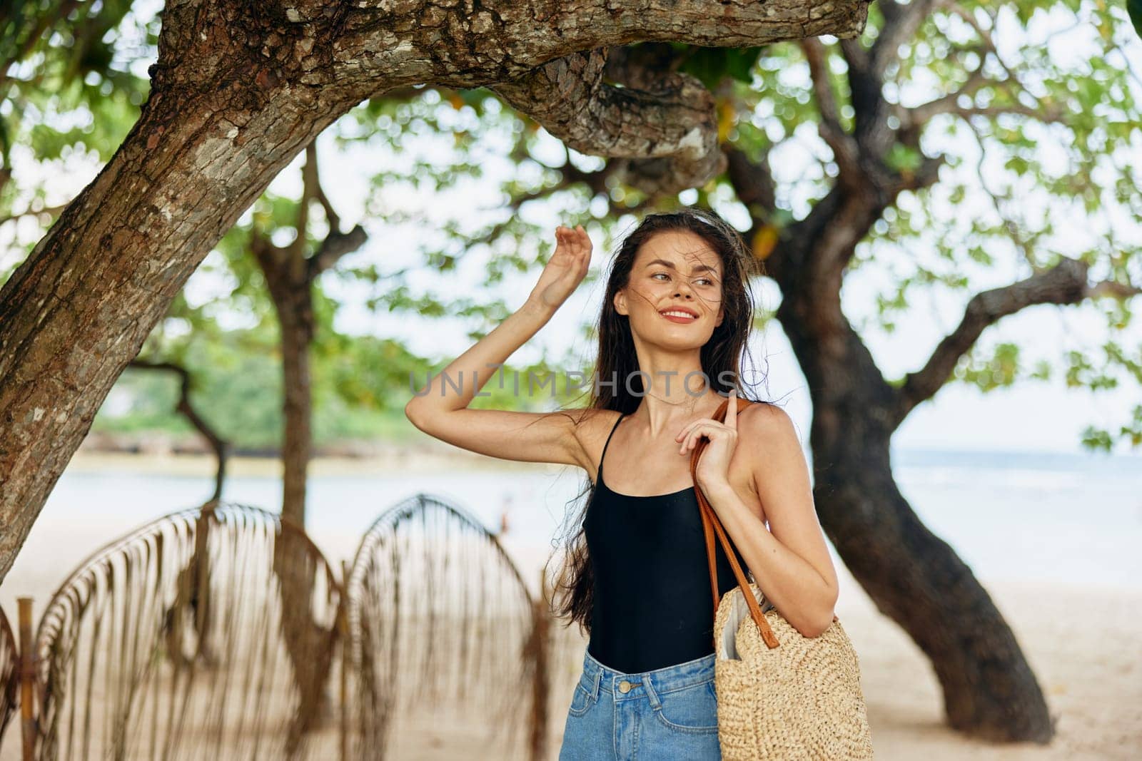 woman freedom walk vacation hair beach water young smiling sunlight person beauty sea dress running smile long carefree summer ocean nature sand