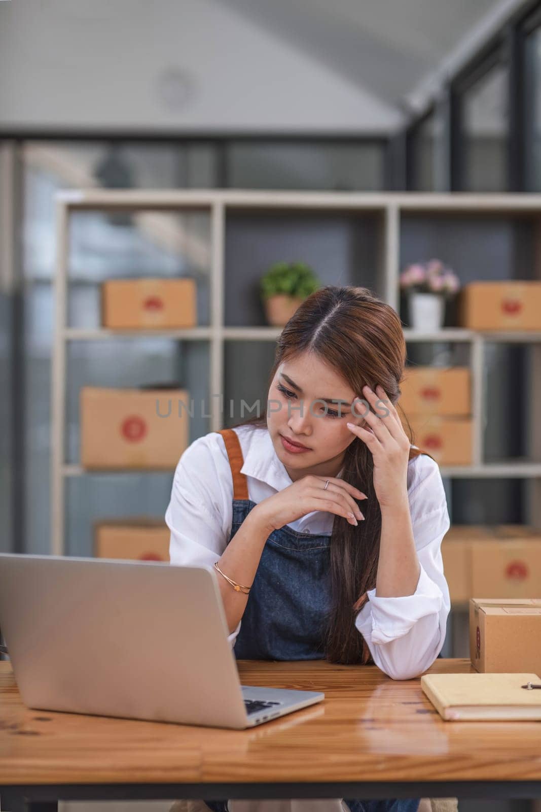 Small Business, Startup SME, Owner Entrepreneurs. Asian woman with unsuccess business online shopping crying and serious face unhappy mood. by wichayada