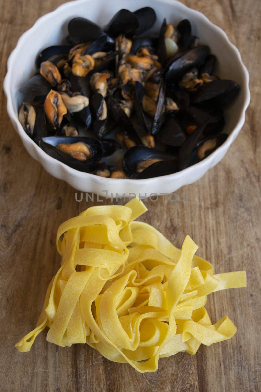 raw egg tagliatelle with tomato and mussels