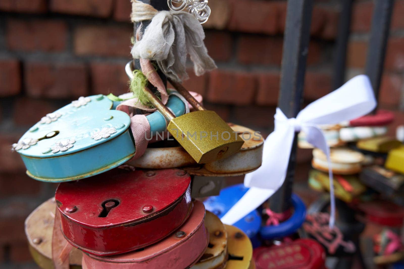 Many old different love locks on the fence