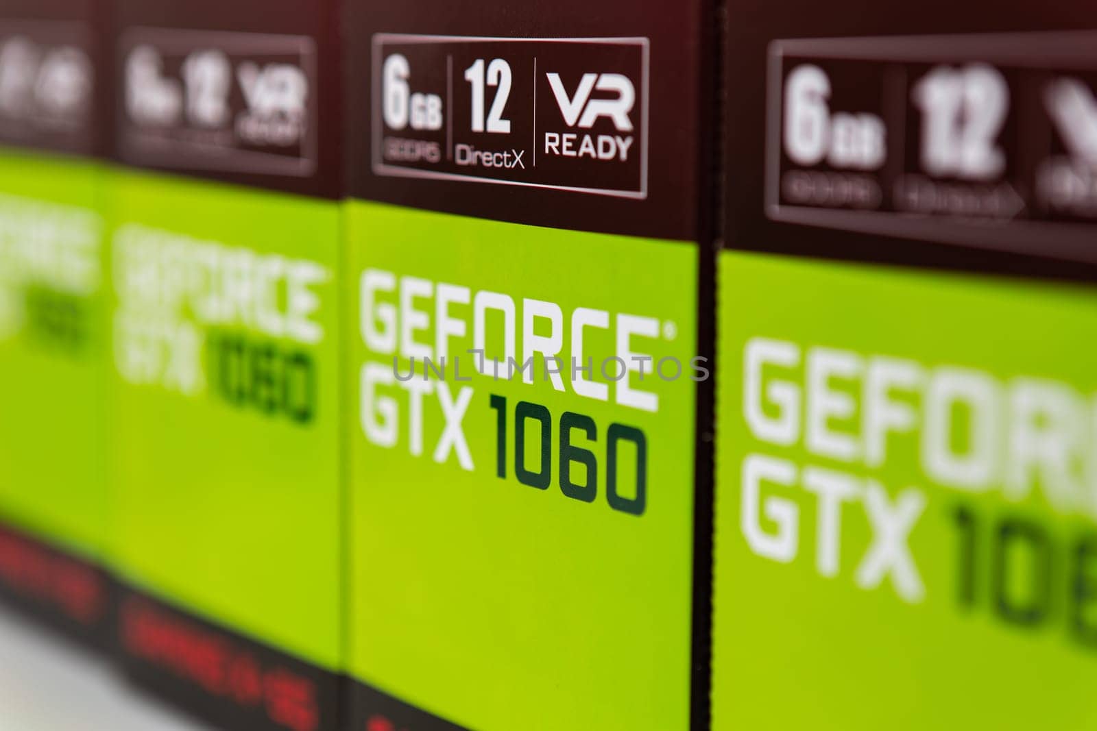 Kyiv, Ukraine - 27 January 2022: Four packages in a row Nvidia Geforce GTX 1060 graphics card. Components for a personal computer - boxes MSI Gaming X video cards on a store counter. Selective focus