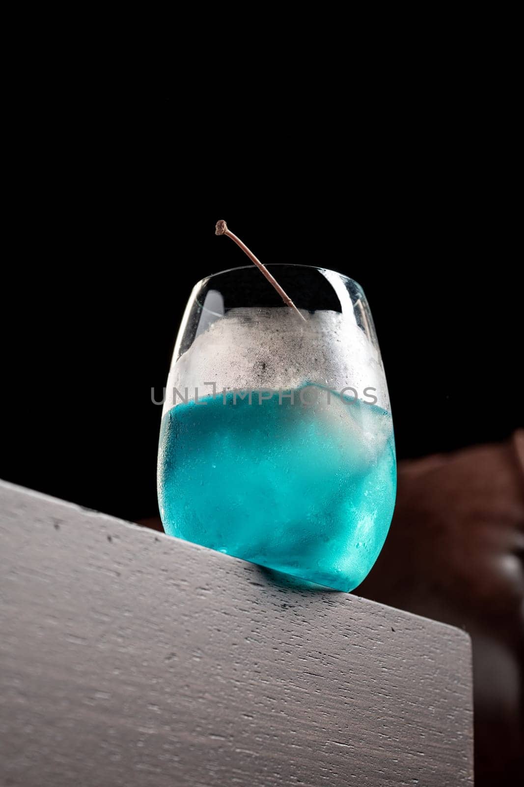 Luxury cocktail on the wooden table on a dark background