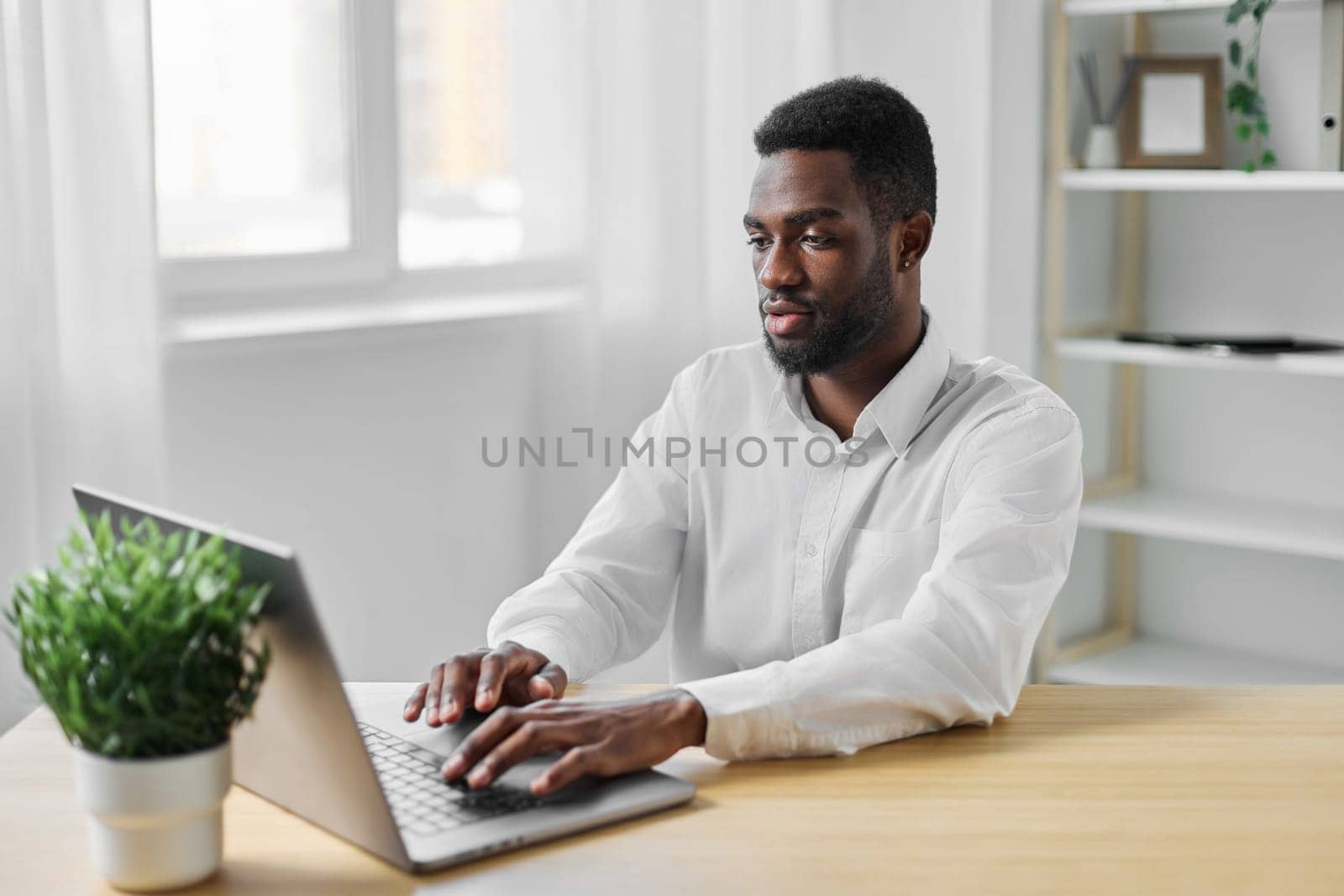 man computer job copy cyberspace web american blank office corporate student laptop african employee space education workplace desk call freelancer young space indoor online