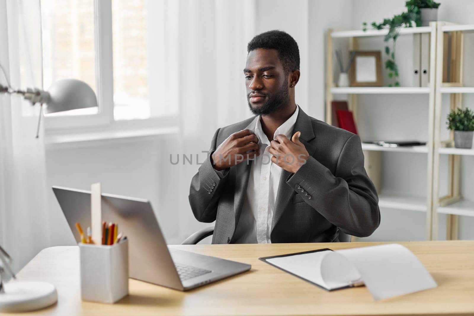 man african freelancer office education laptop online job student computer workplace american by SHOTPRIME