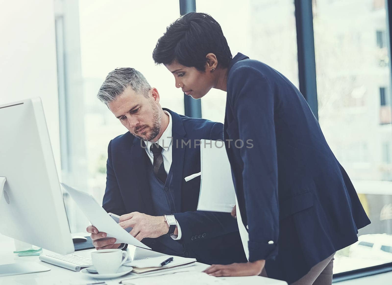 Making technology work for their collaboration. a businesswoman and businessman collaborating on a project at work