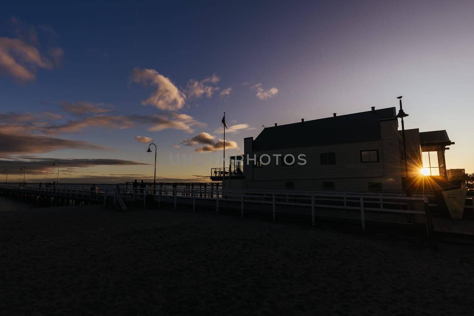 Kerford Rd Pier and Albert Park Yachting & Angling Club in Albert Park at sunset on a winter's evening in Melbourne, Victoria, Australia