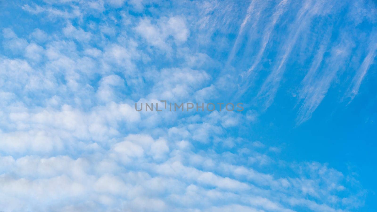 A blue sky background with white clouds by Renisons