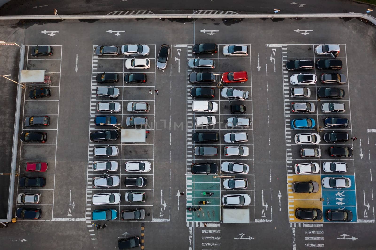 Car parking near shopping mall aerial view by andreonegin