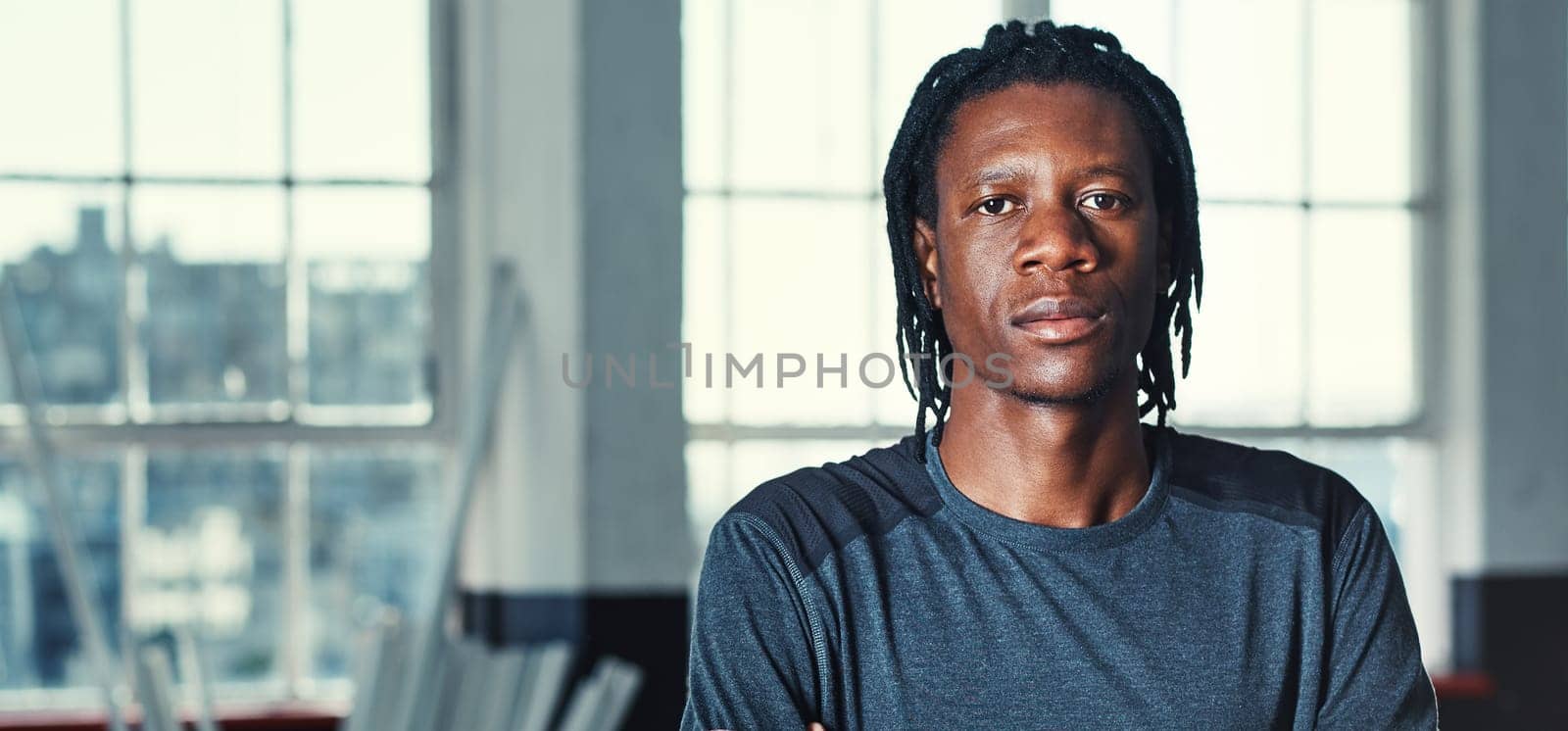 The secret of getting ahead is getting started. Portrait of a young man in a gym