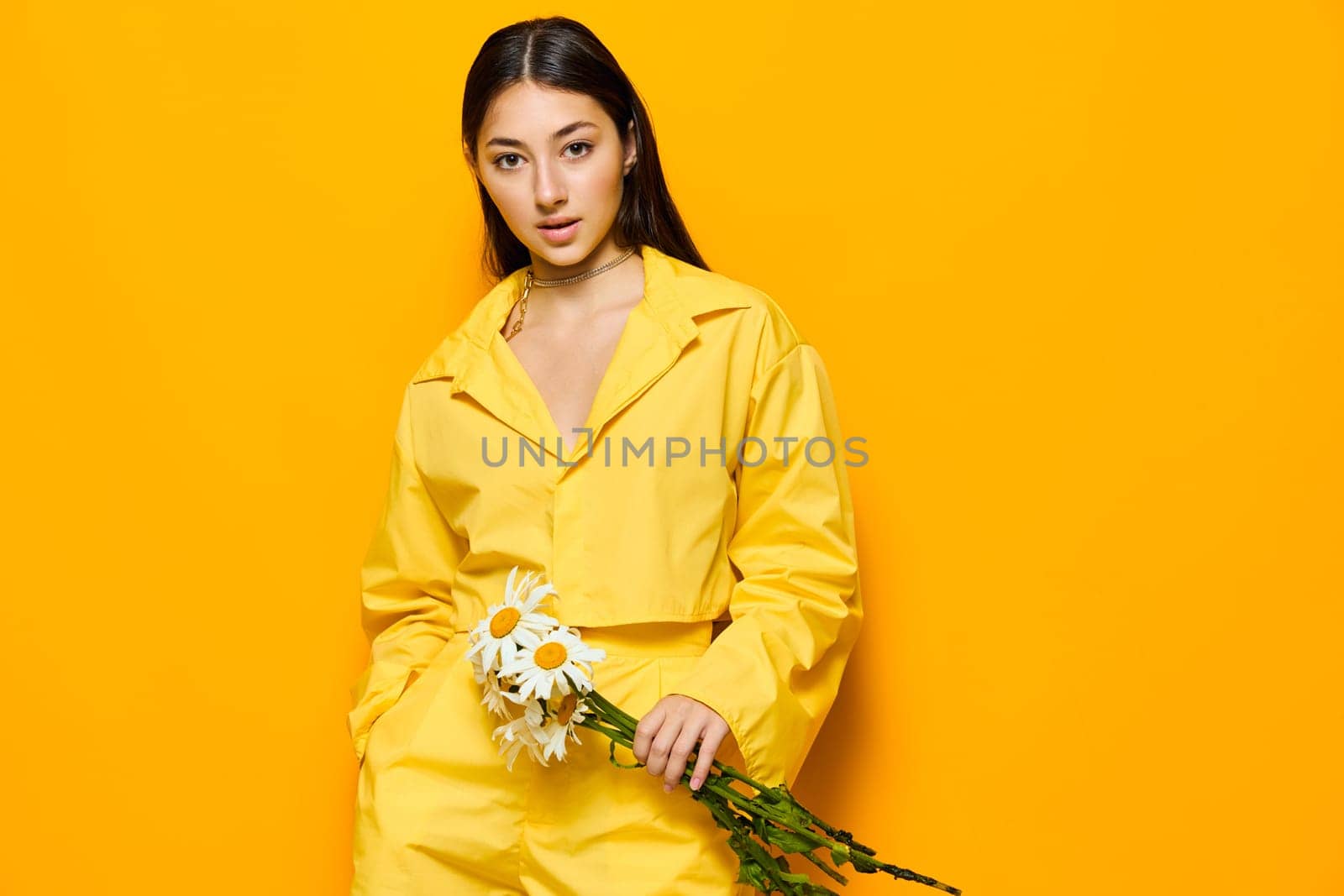 woman joyful pretty portrait flower yellow chamomile happiness smile model young by SHOTPRIME