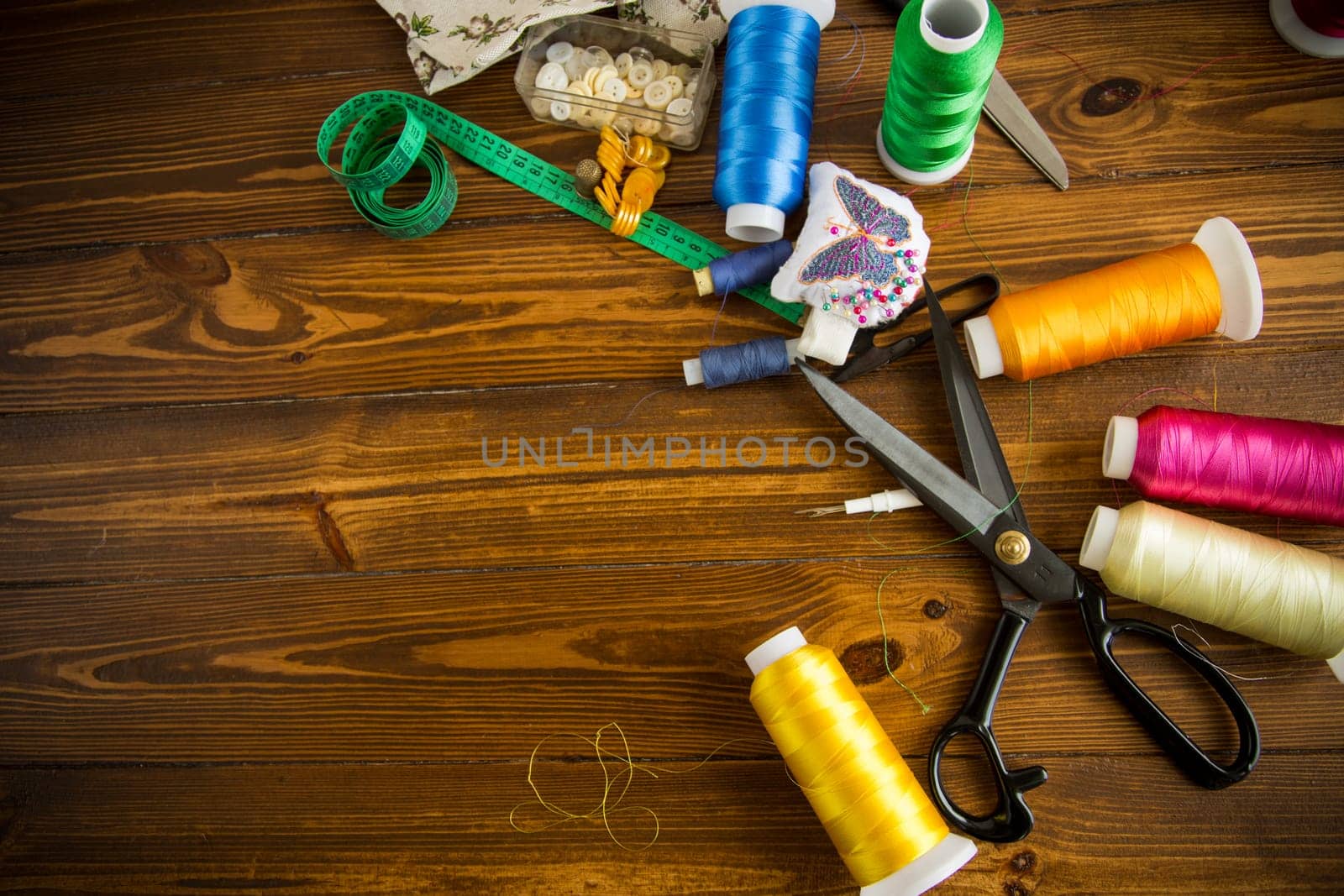 a set of tools and threads for sewing clothes by Rawlik