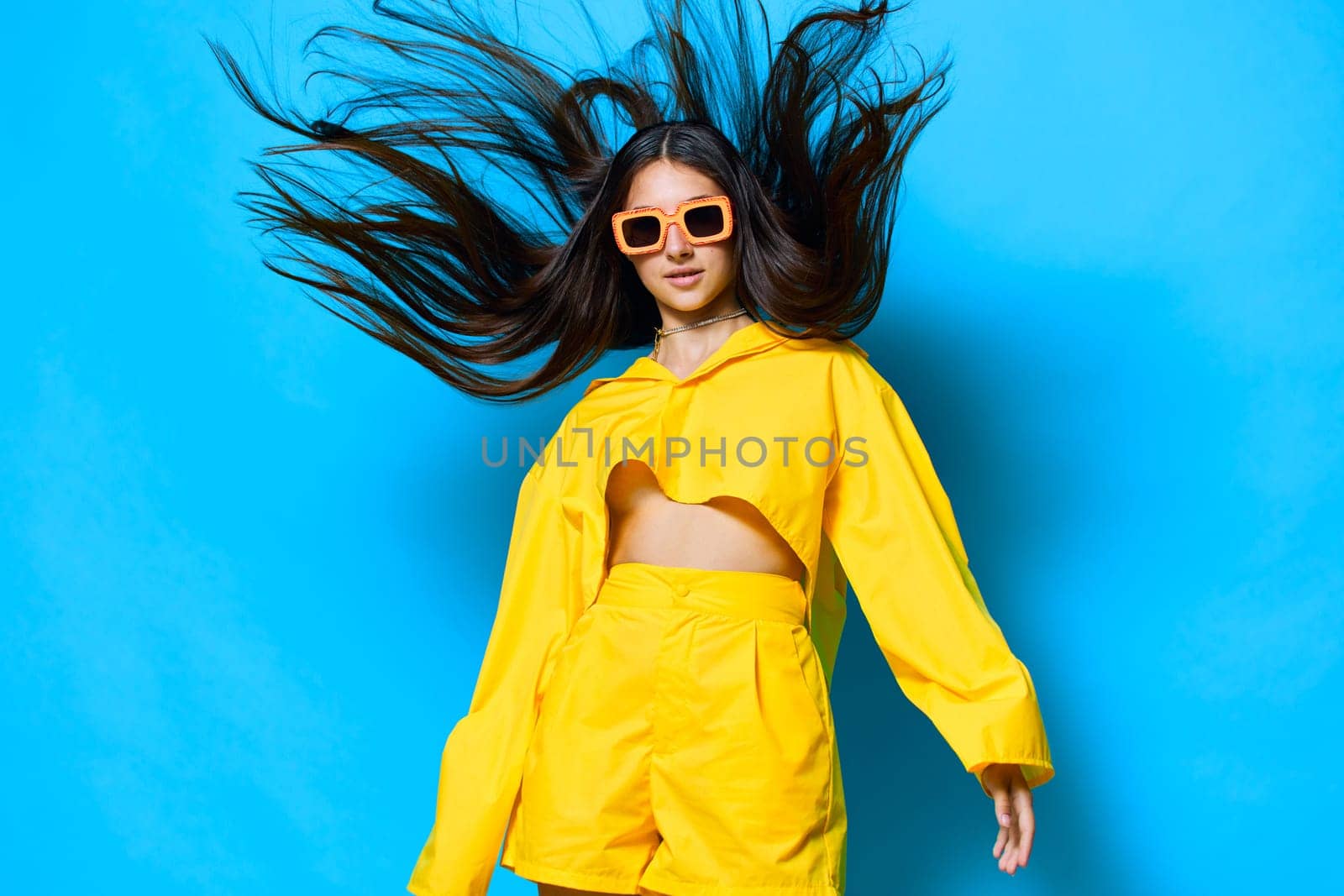 isolated woman lifestyle young female girl joy style expression trendy creative gesture sunglasses yellow romance fashion happiness beautiful attractive brunette smile