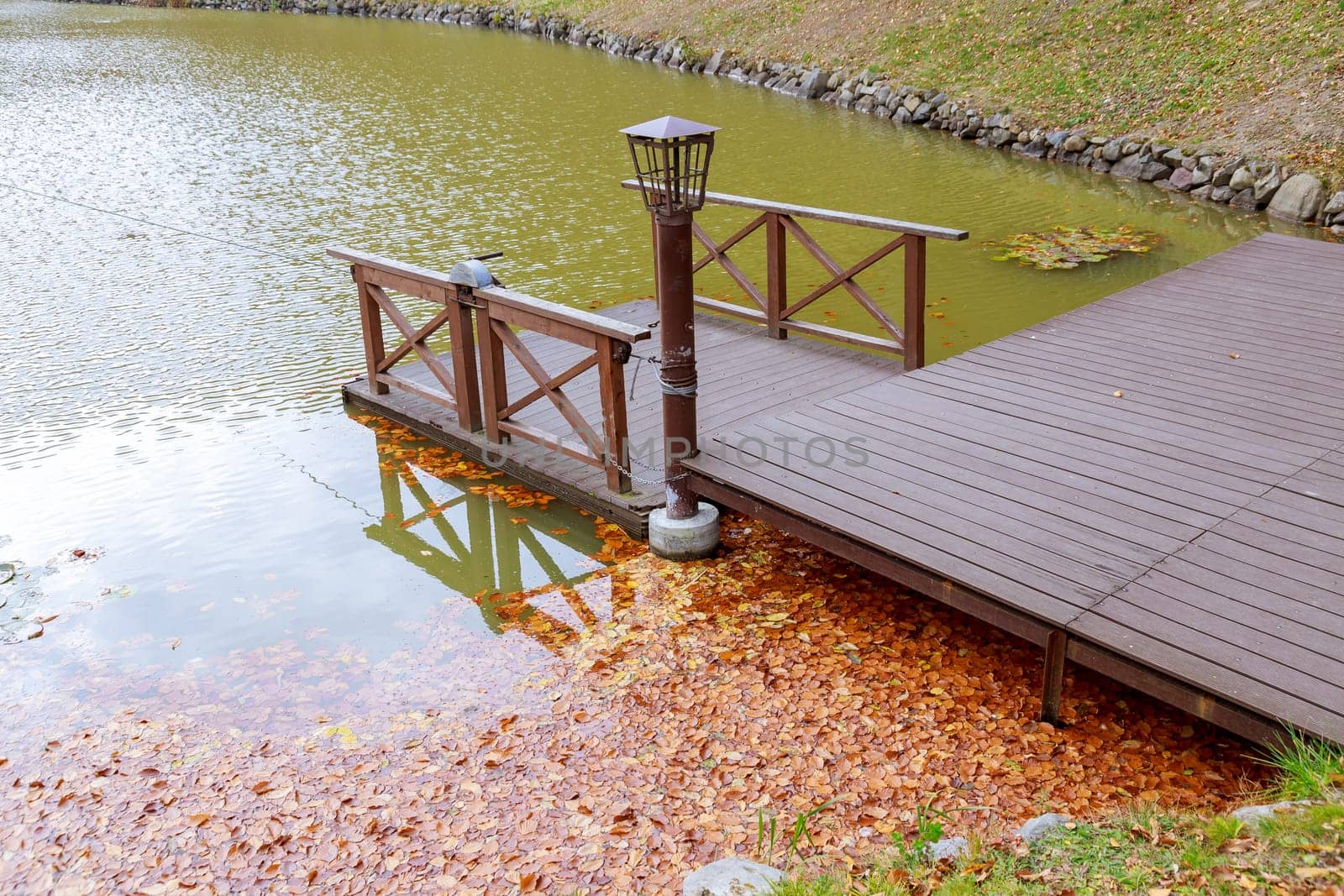 With every gust of wind, lake became temporary resting place for countless leaves.