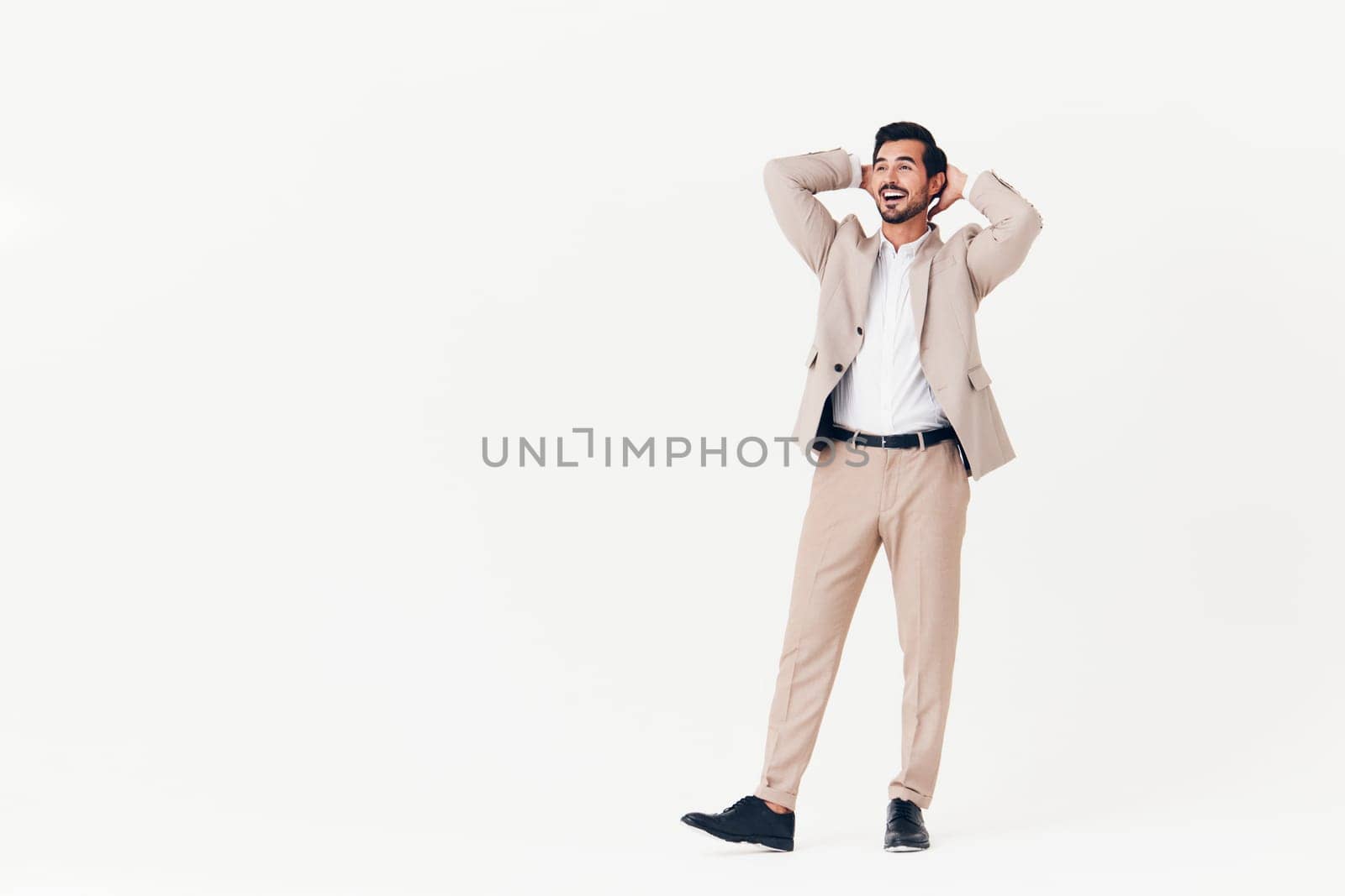 beige man suit victory running happy smiling confident businessman business winner by SHOTPRIME