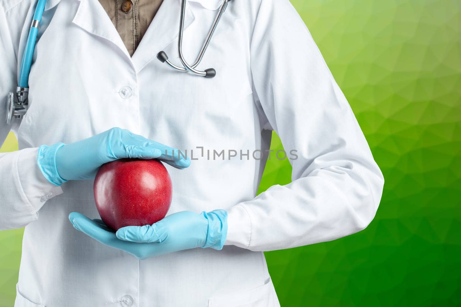 dentist holding a ripe apple
