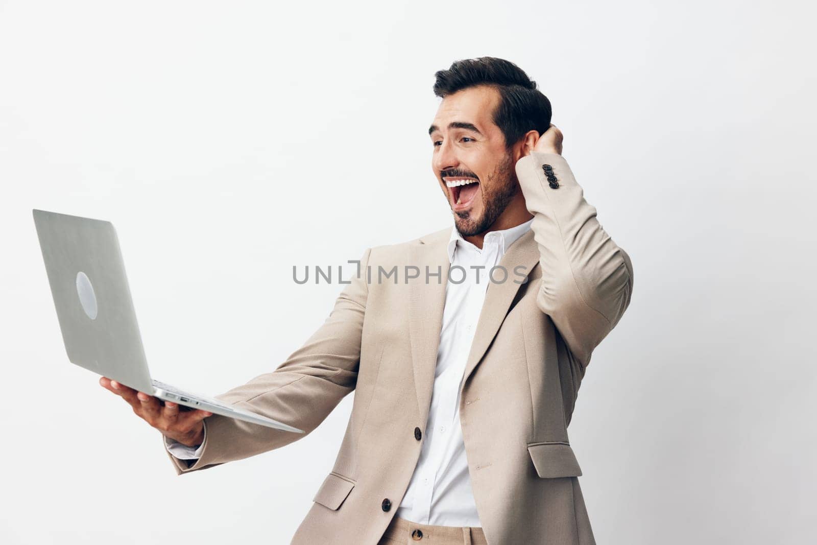 man smiling stylish work beard copyspace notebook freelancer business model laptop working white studio adult suit job internet computer technology businessman