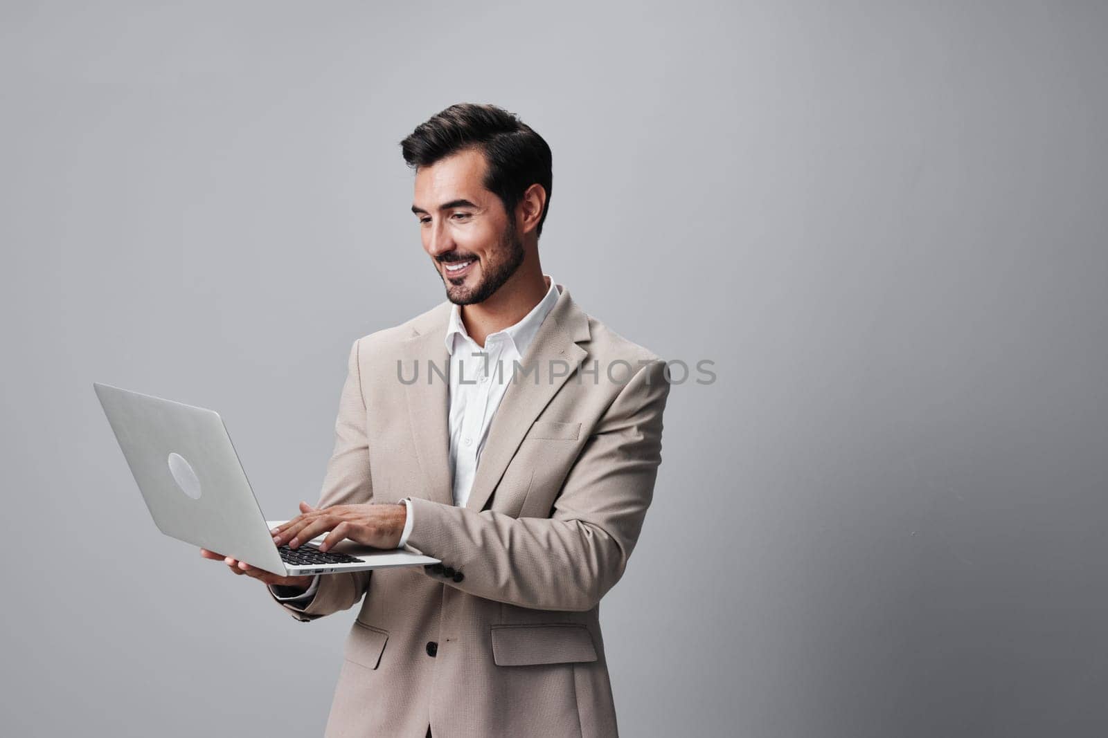 man freelancer smiling model laptop suit business job computer copyspace internet by SHOTPRIME