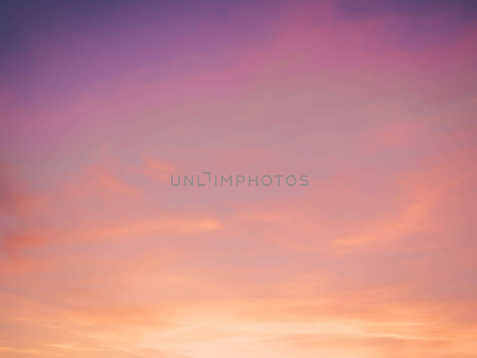 Fresh air, weather concept. Abstract idyllic winter frosty orange and purple sky. Soft, fluffy and colorful cloud formation. Blur background texture of colorful sunset. Twilight sky.