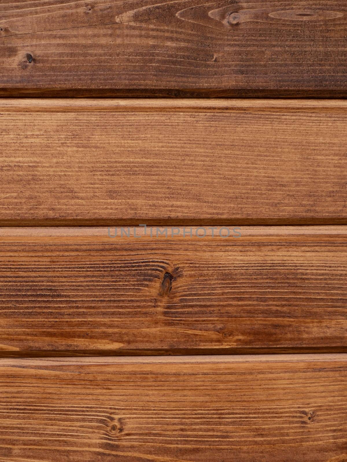Hardwood light brown. Shabby wooden wall background. Texture of obsolete carpentry wooden boards, panel. Vintage orange wood floor. Wooden plank grunge texture. Vertical view