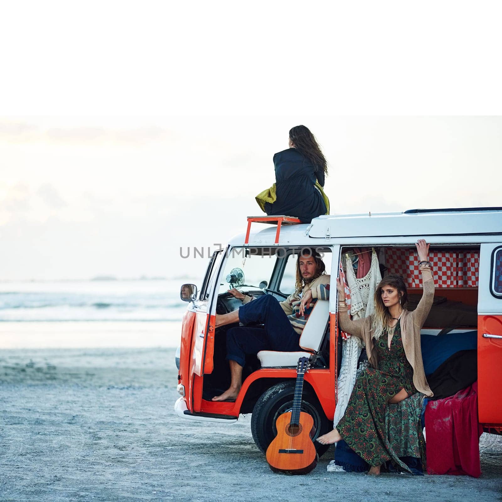 Go where the journey takes you. a group of young friends stopping at the beach during a roadtrip. by YuriArcurs