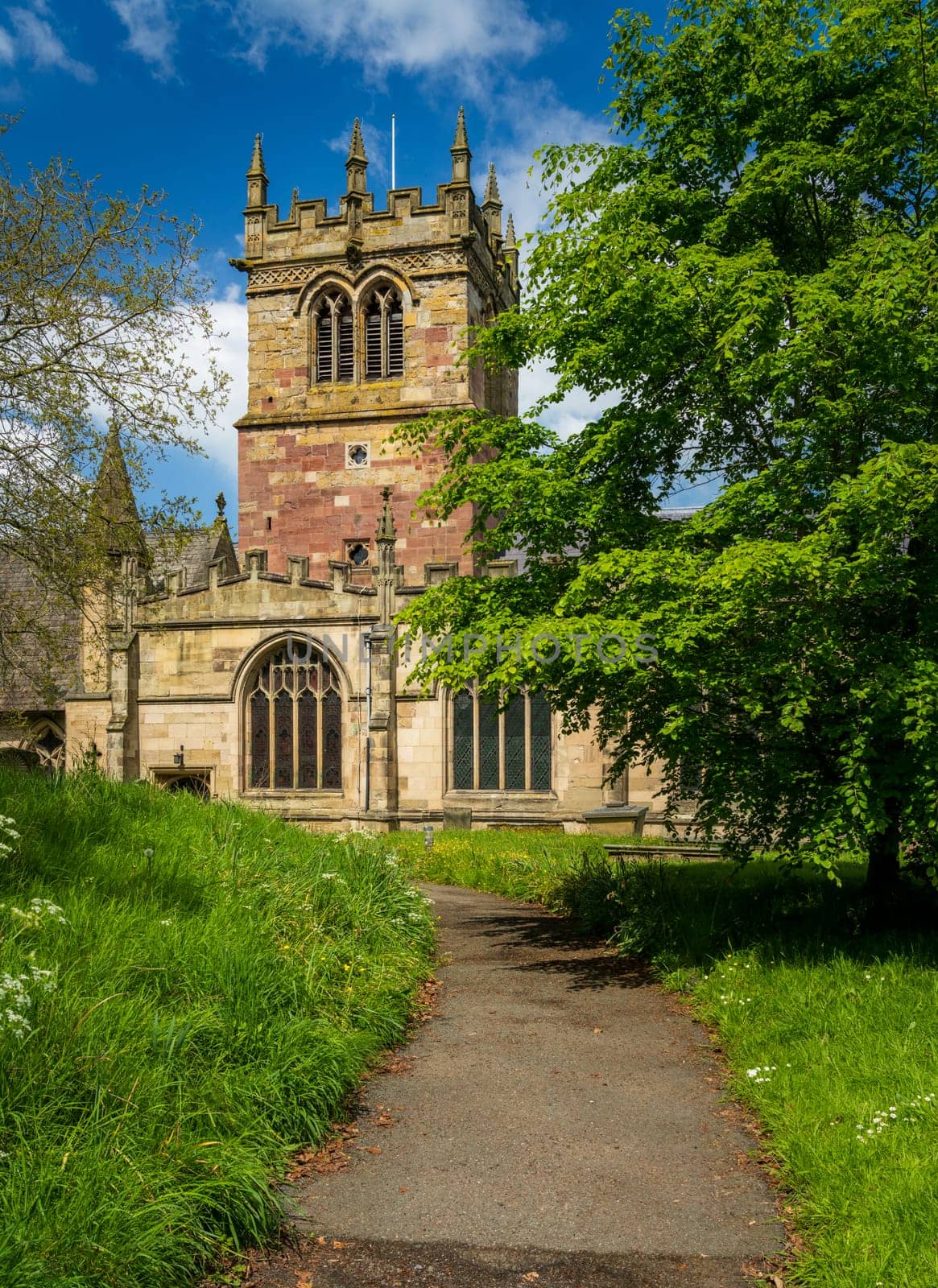 Church tower of parish church of St Mary in Ellesmere Shropshire from churchyard