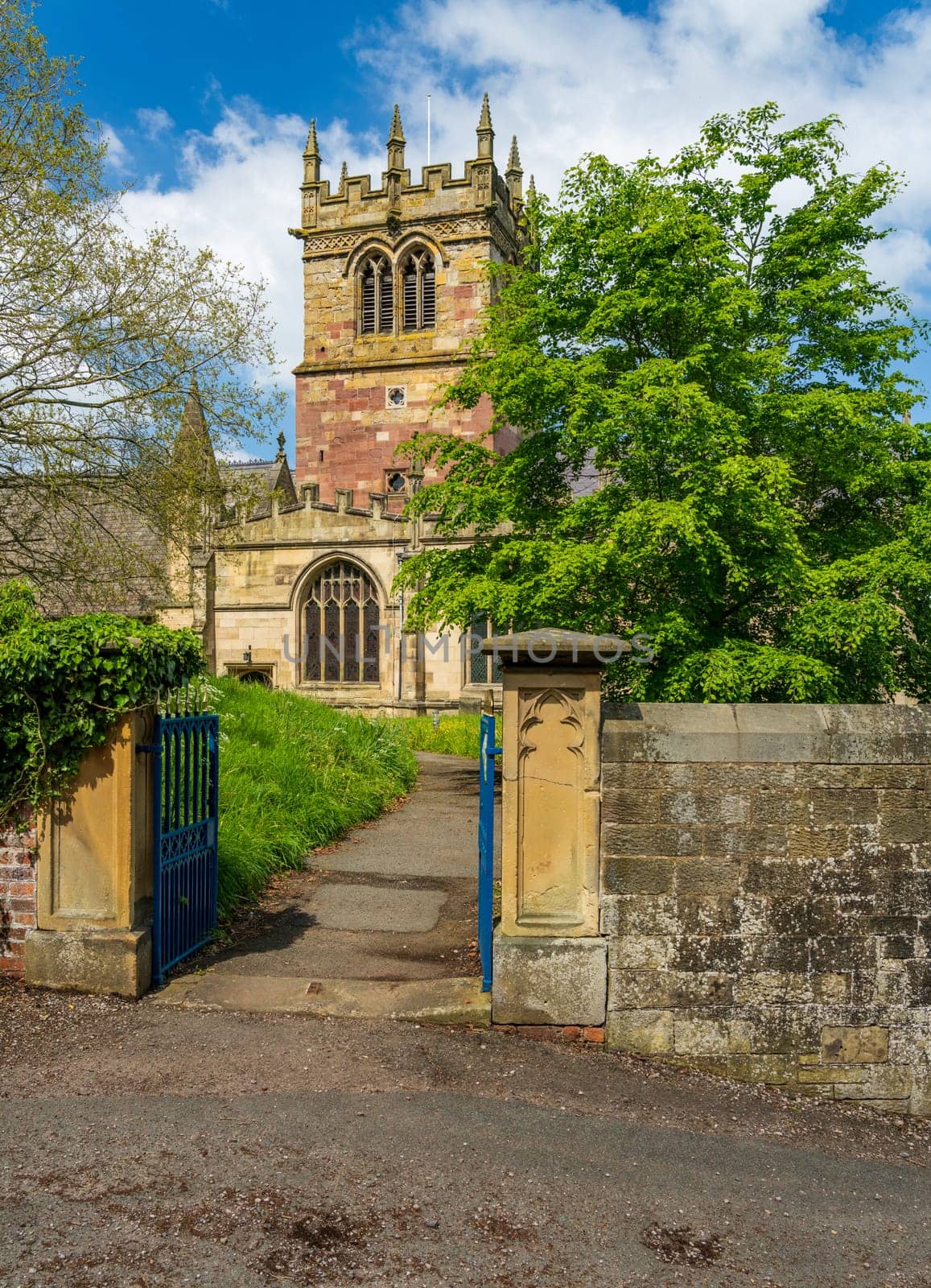 Church tower of parish church of St Mary in Ellesmere Shropshire from churchyard