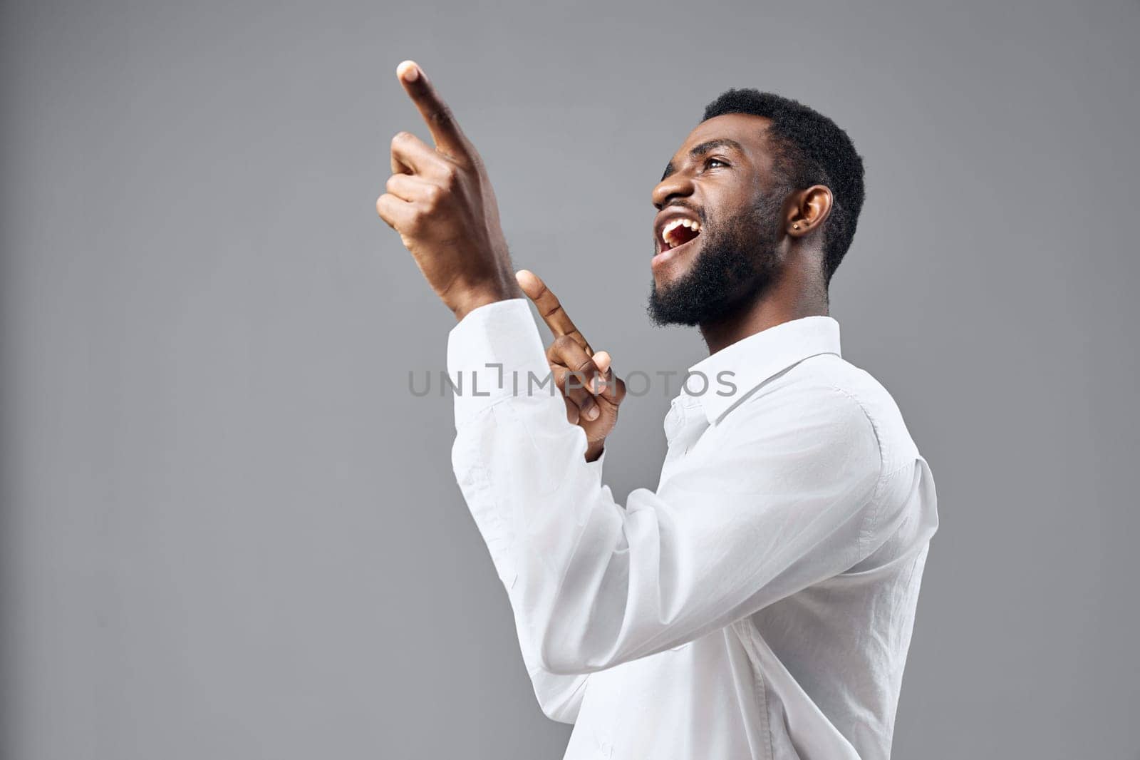 space man standing smile young person copy american shirt happy white studio african by SHOTPRIME