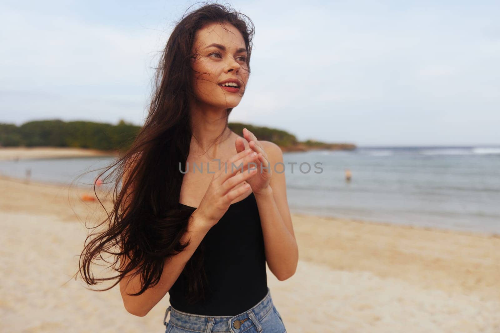 woman beautiful sand beach sunset running lifestyle vacation dress sea sky beauty young smile copy-space carefree peaceful happy leisure summer ocean