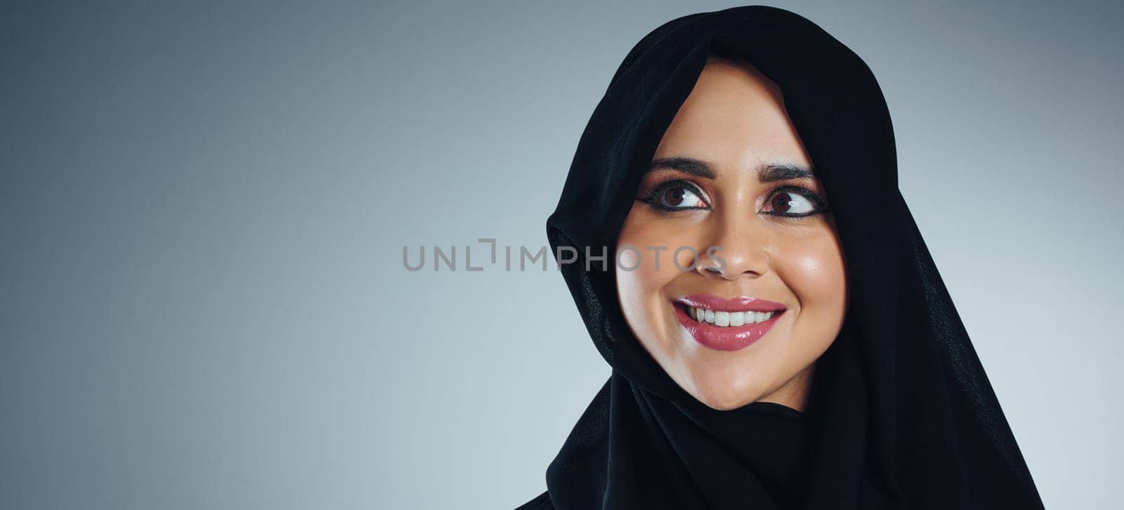 Positive thoughts become positive actions. Studio shot of a young muslim businesswoman against a grey background