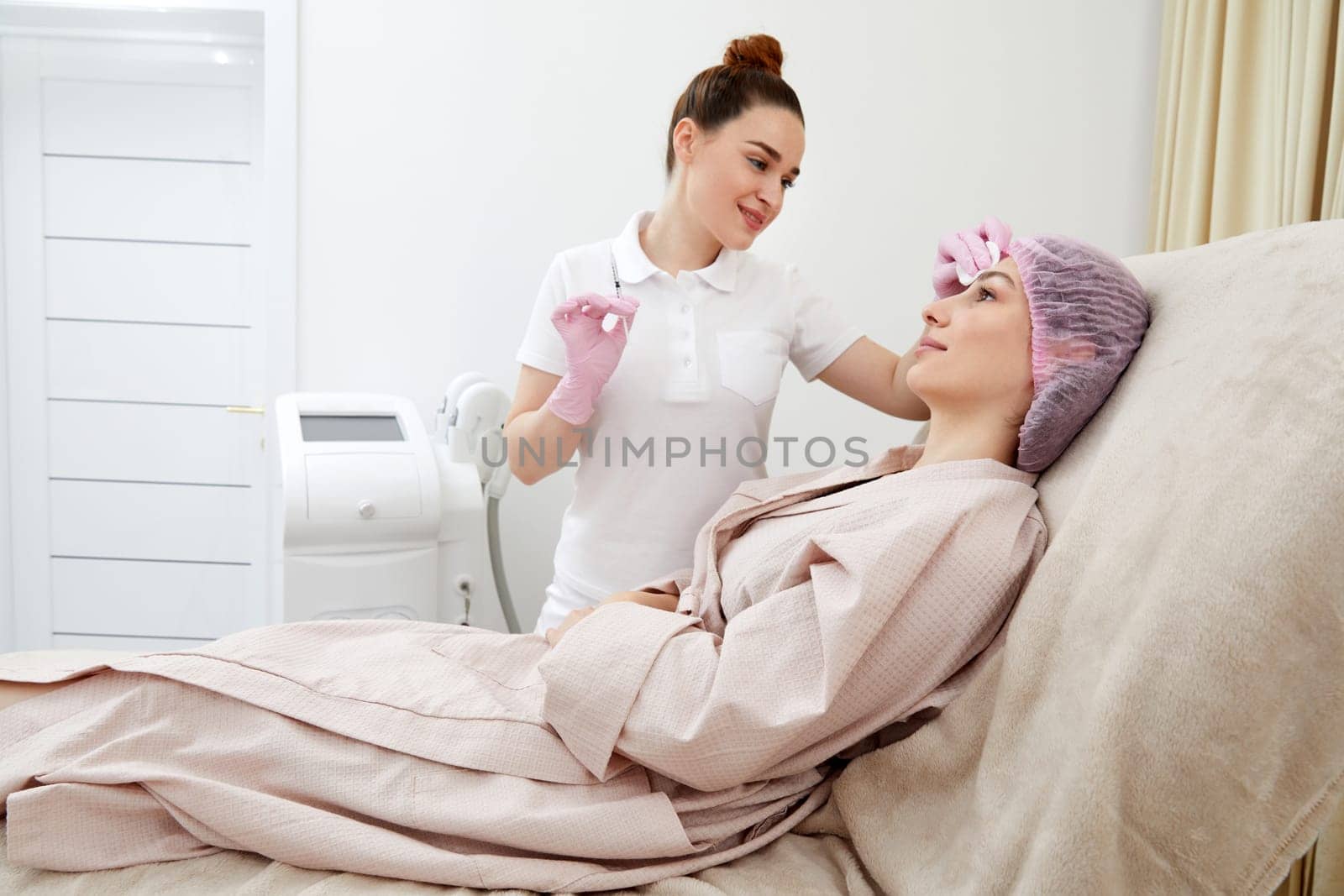 Cosmetologist performs the lift procedure by injecting beauty injections. Doctor injecting hyaluronic acid as a facial rejuvenation treatment