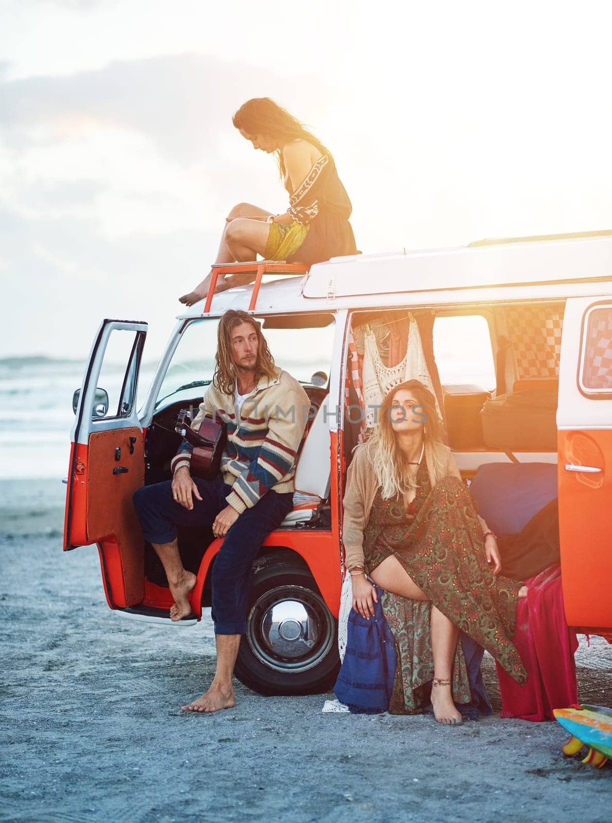 Time for a beach break. a group of young friends stopping at the beach during a roadtrip. by YuriArcurs