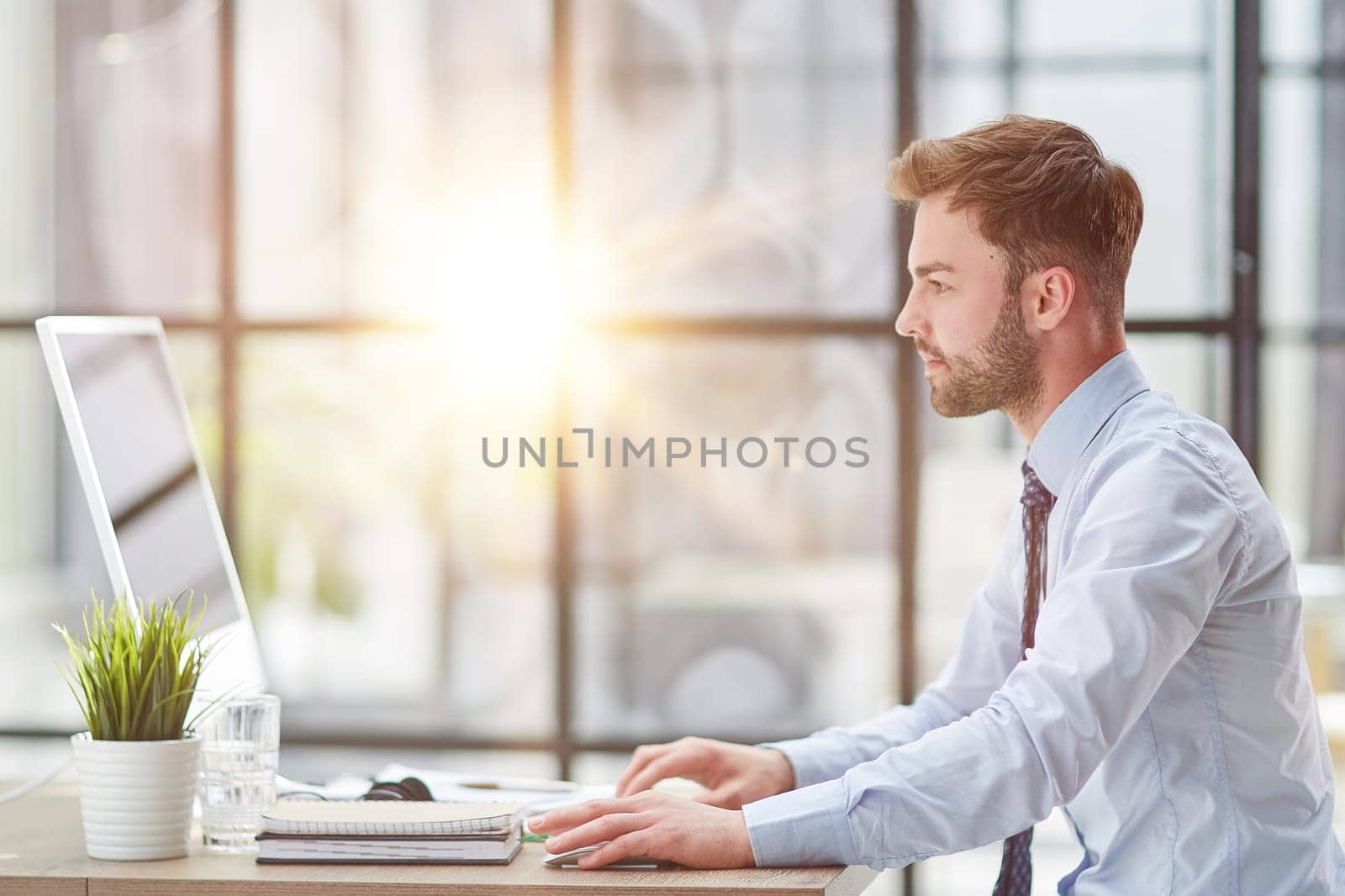 Young businessman working at office