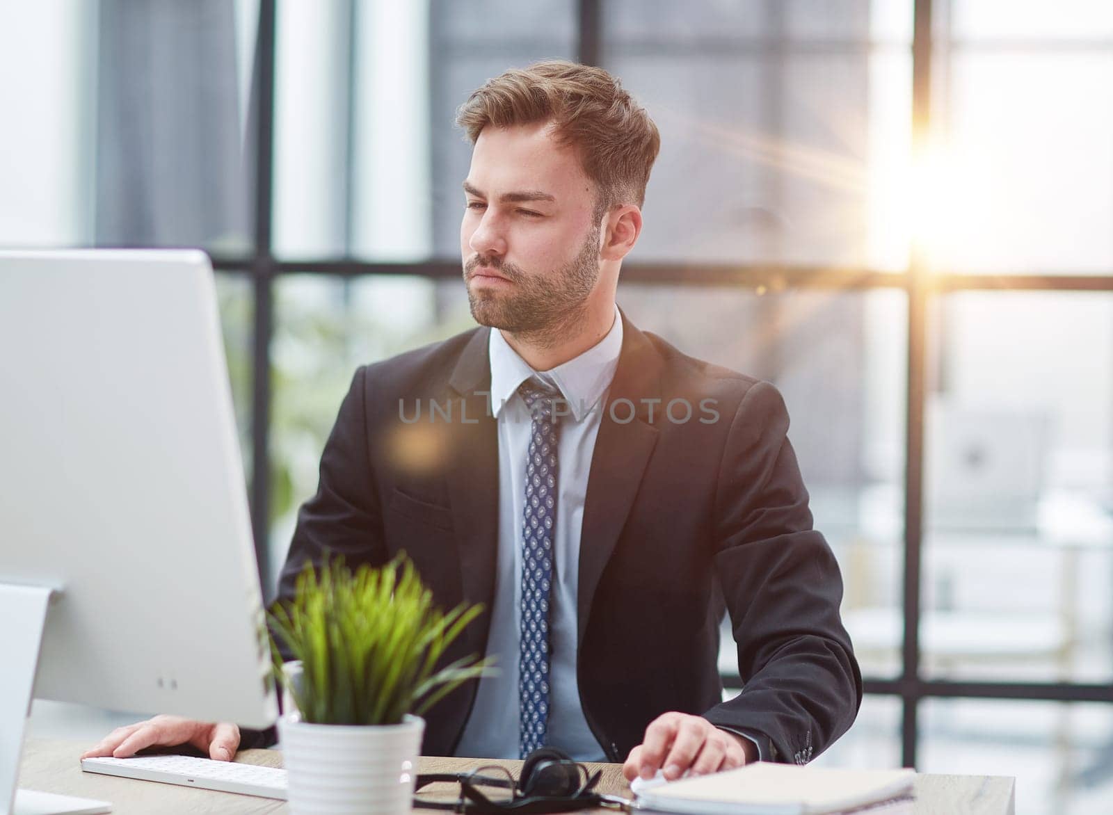 Young businessman working at office