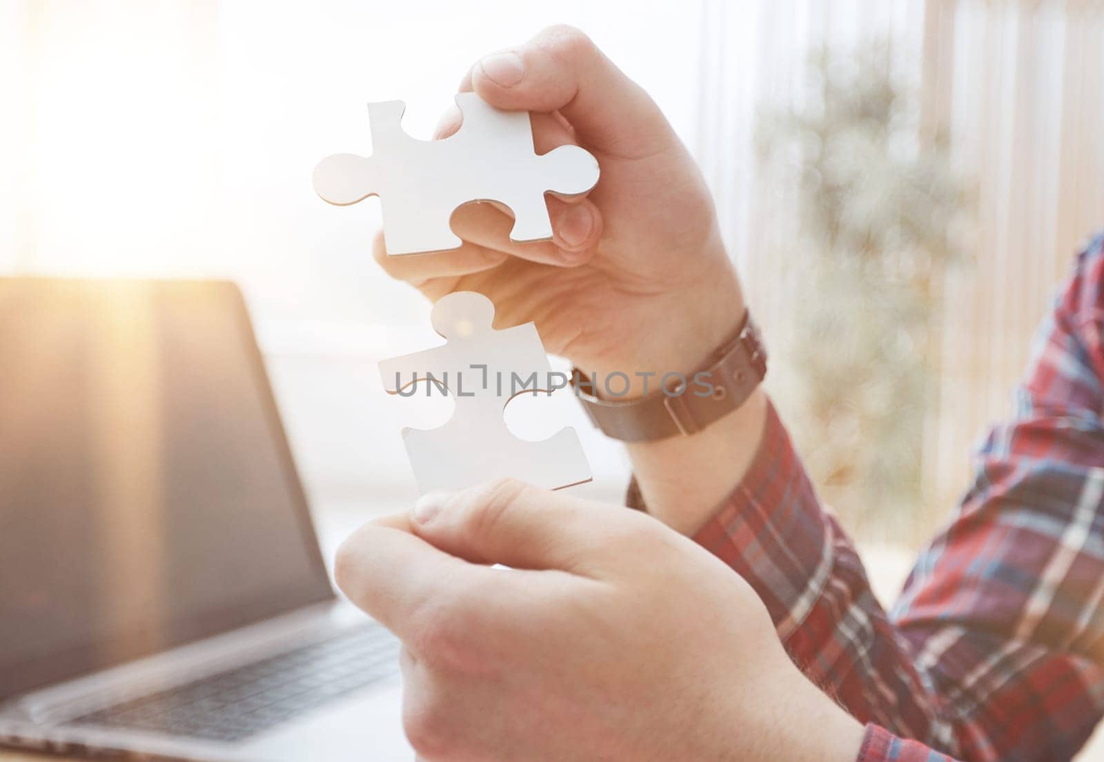 Businessman hands connecting jigsaw puzzle. Business solutions, success and strategy