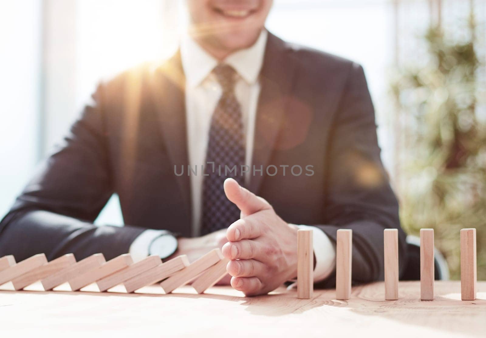Businessman with dominoes in the office