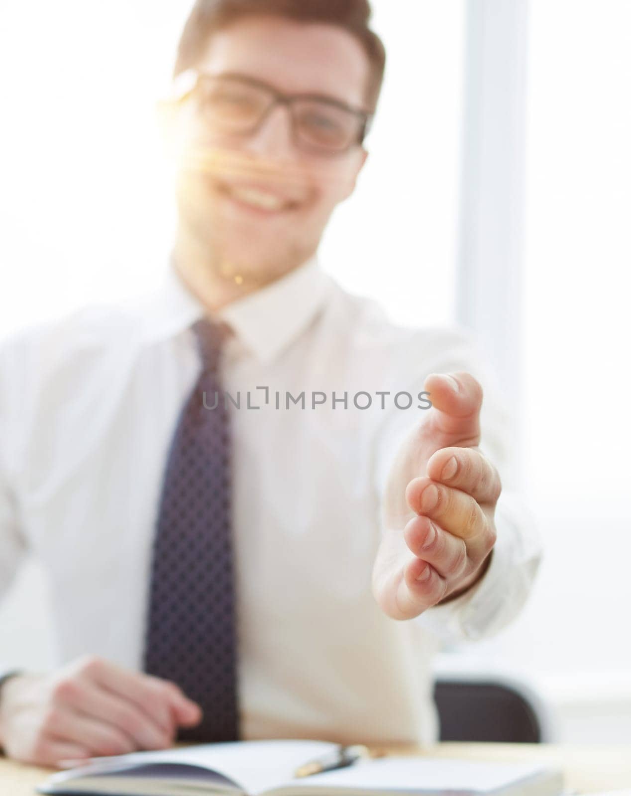 Smiling businessman pleased to meet you at office