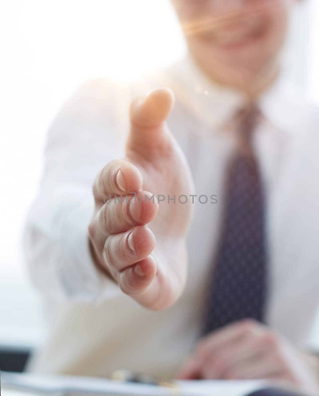 Smiling businessman pleased to meet you at office