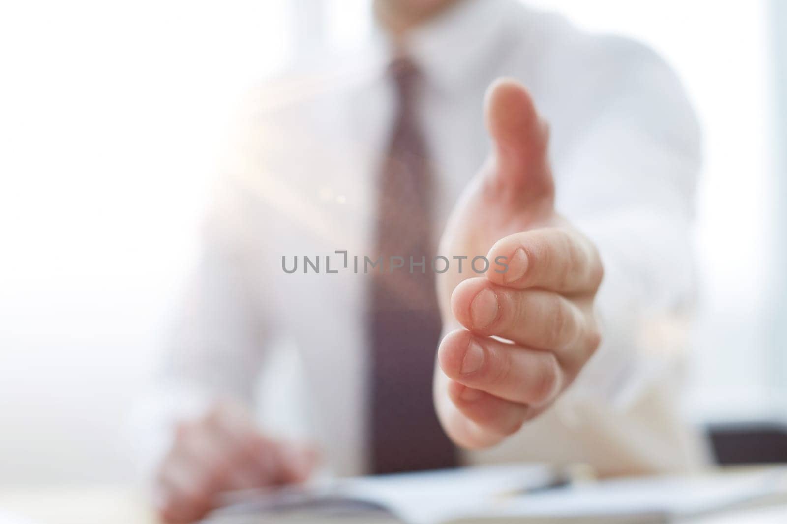 Smiling businessman pleased to meet you at office