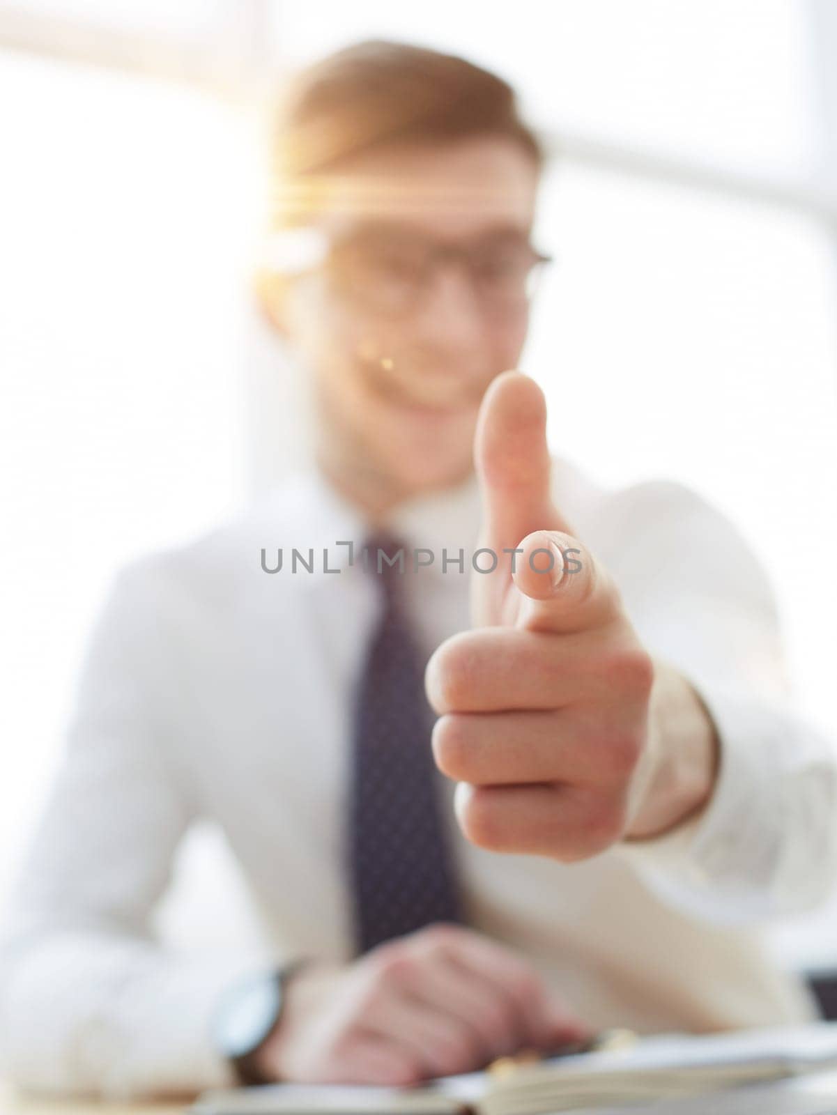 businessman pointing his finger to you at office