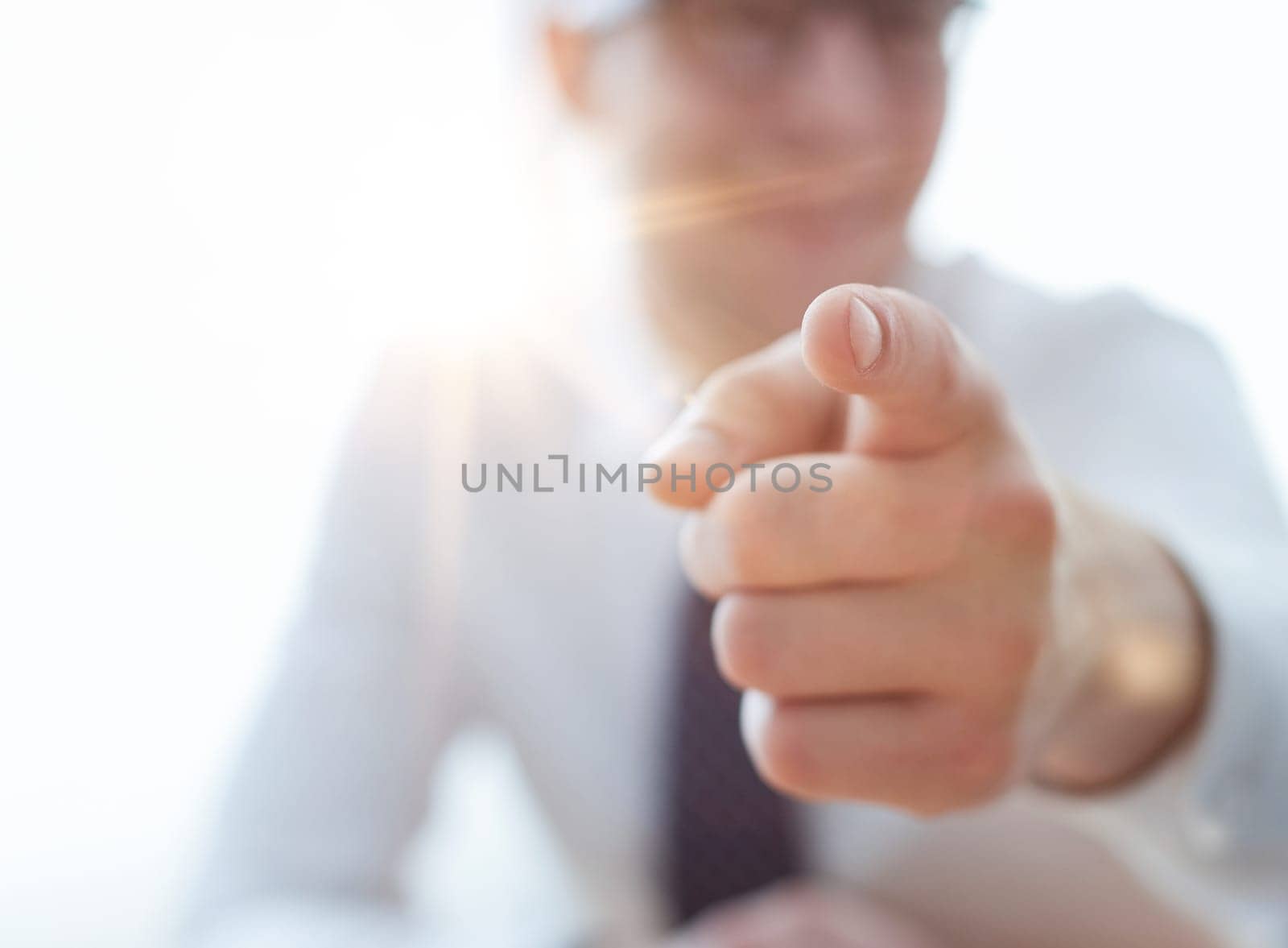 businessman pointing his finger to you at office