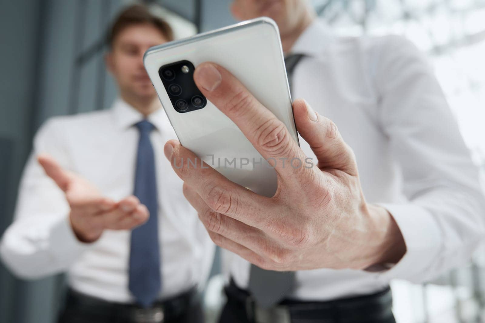 man using smartphone pressing finger, reading social media internet, typing text or shopping online. Mobile phone at home or work.