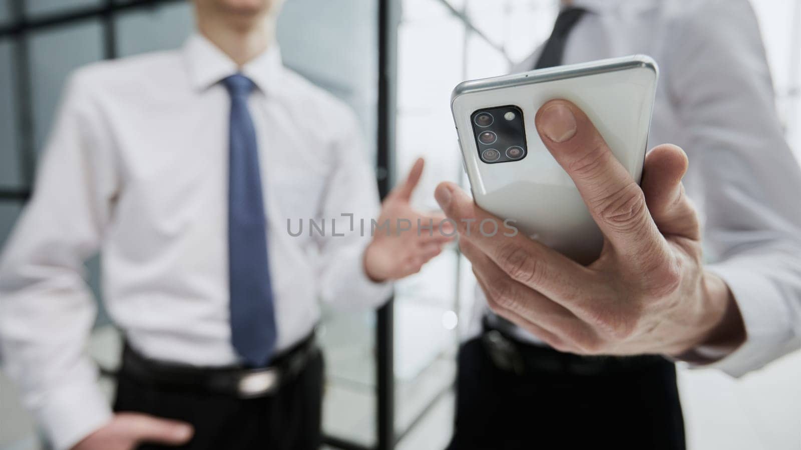 man using smartphone pressing finger, reading social media internet, typing text or shopping online. Mobile phone at home or work.
