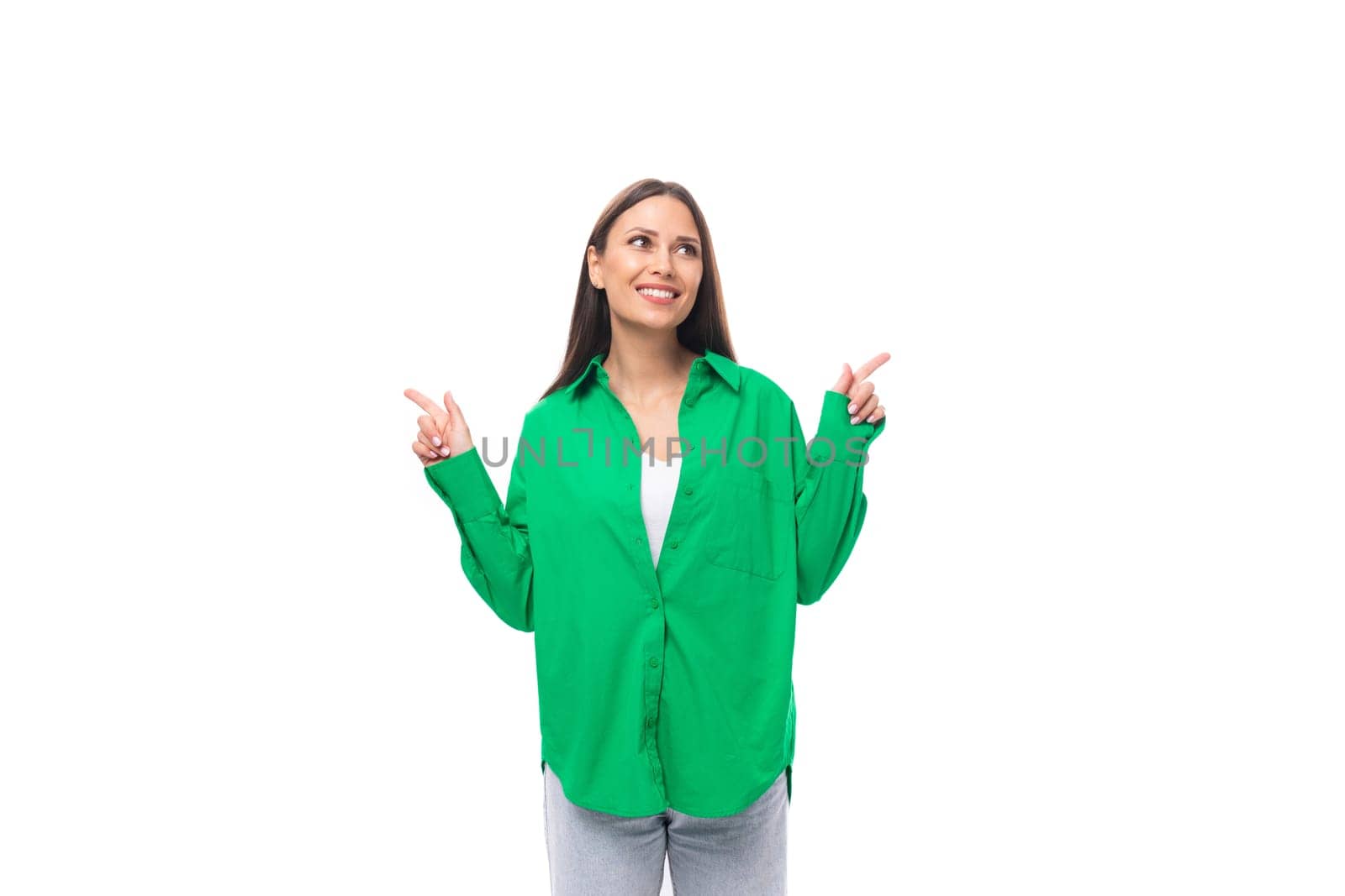 positive slim european young brunette woman with makeup in green shirt on white background with copy space by TRMK