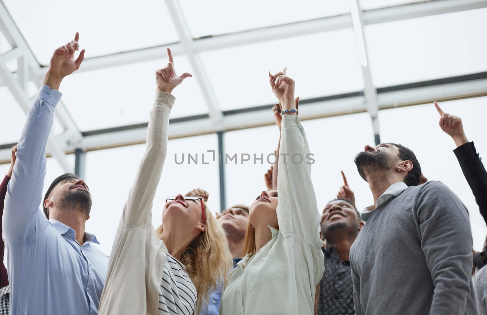 multi-ethnic men and women raise their hands, by Prosto