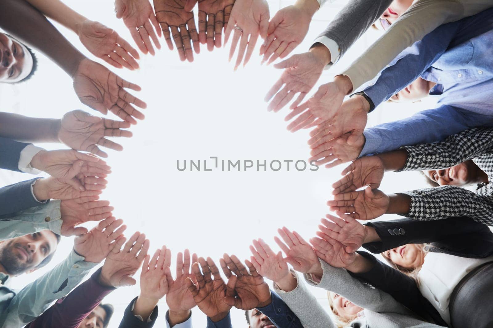 People holding hands together, view from below. Group therapy