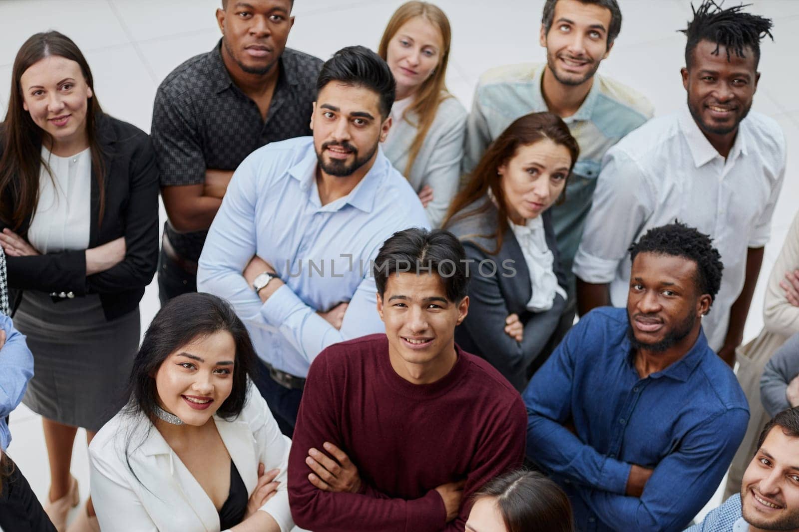 Group of successful business people looking up