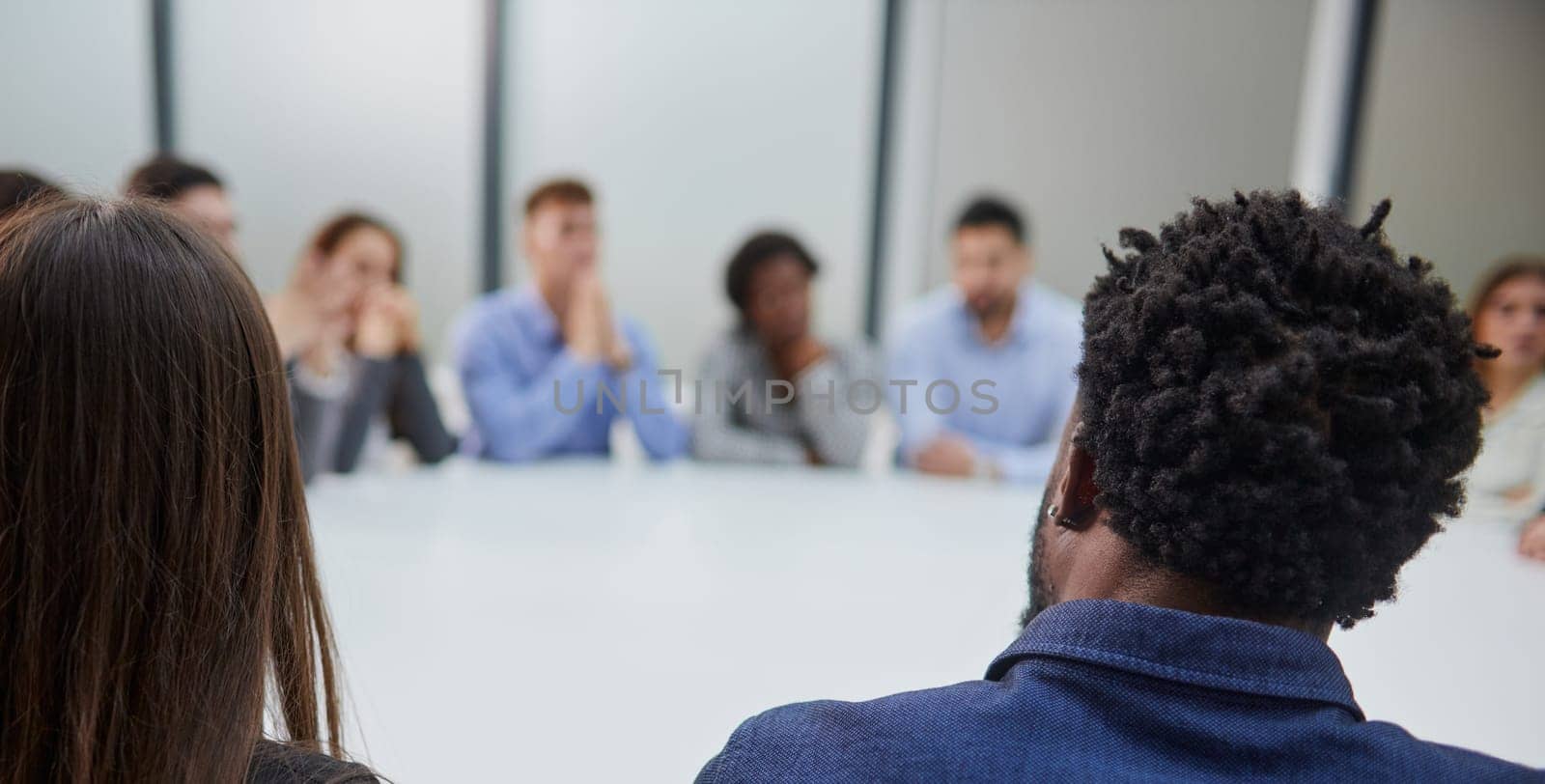 Business people group meeting shot from behind