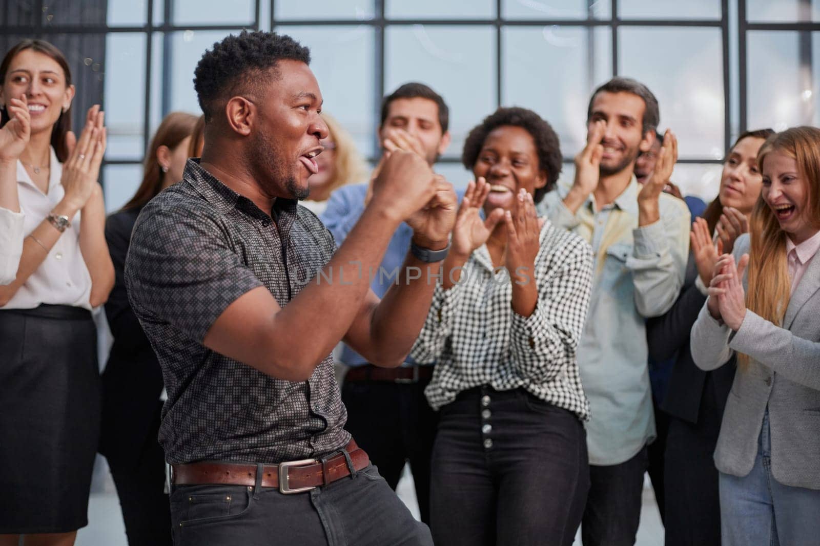 Business team celebrating a triumph with arms up